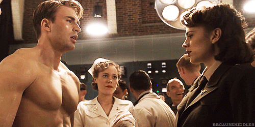 Animated gif from Captain America: The First Avenger. Peggy Carter reaches out and touches Steve Rogers' chest