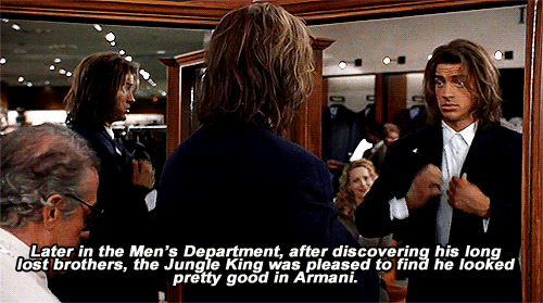 Animated gif of "George of the Jungle" showing Brendan Fraser being fitted for a suit. Text reads: "Later in the Men's Department, after discovering his long lost brothers, the Jungle King was pleased to find he looks pretty good in Armani"