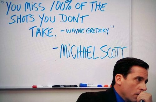 screenshot of "The Office" — Michael Scott posing in front of a whiteboard that reads "You Miss 100% of the Shots You Don't Take — Wayne Gretsky. — Michael Scott".