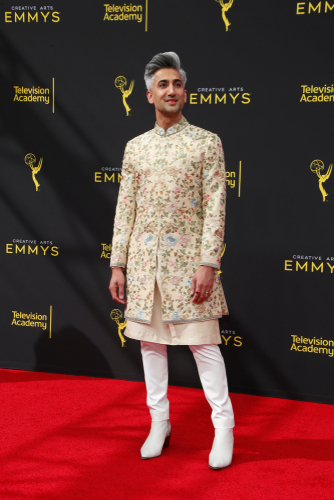 Tan Francein a layered jacket, dress and boots combo at the 2019 Primetime Emmy Creative Arts Awards