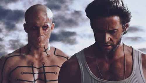screen capture of Wolverine: Origins. Ryan Reynolds stands behind Hugh Jackman